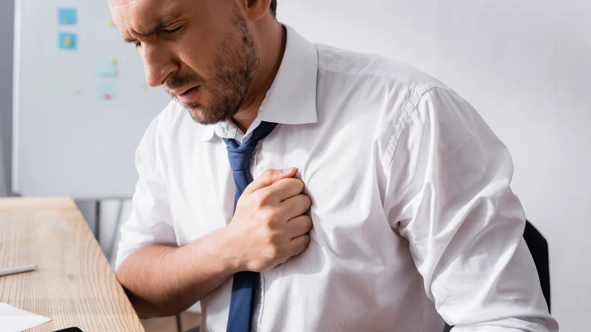 man at work chest pain